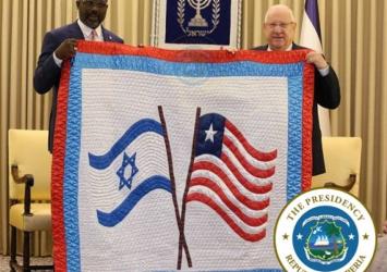 Israeli President Reuven Ruvi Rivlin presents a quilt President Weah as a sign of cordial bilateral relationship between the two countriesExecutive Mansion Photo