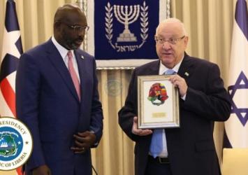 Israeli President Reuven Ruvi Rivlin welcomed President Weah to Israel and gave him a Hamsa to wish him good luckExecutive Mansion Photo