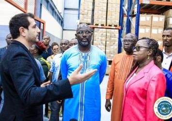 President Weah and delegation listen to the Supply chain mechanism instituted at the CMS Warehouse in CaldwellExecutive Mansion