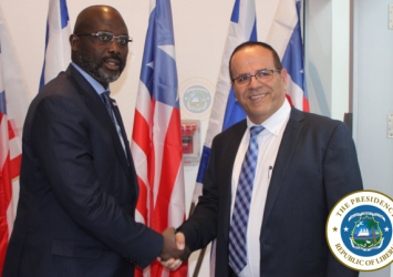  President Weah shakes hands with the Minister of Communications Ayoob Kara of Israel, Mr Ayoob Kara Executive Mansion