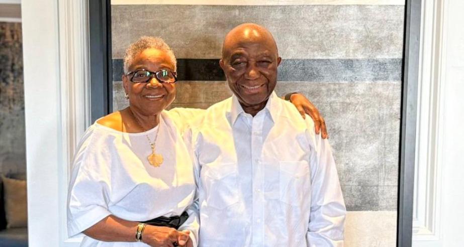 President Boakai poised in a photograph with the wife of the former Minister of State, Sylvester Grisby