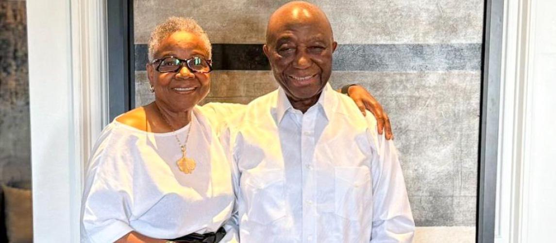 President Boakai poised in a photograph with the wife of the former Minister of State, Sylvester Grisby