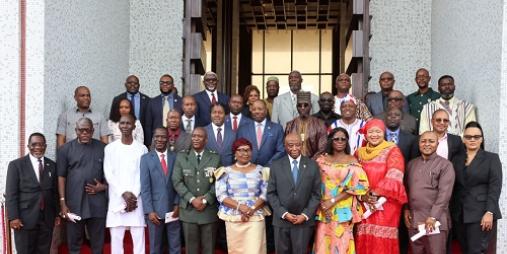 Officials of government pose in a photo with President Boakai